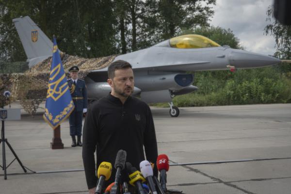 President Volodymyr Zelensky answers media questions standing against the background of Ukraine’s Air Force’s F-16 fighter jets in an undisclosed location in Ukraine earlier this month.